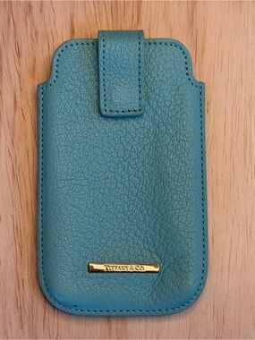 Tiffany & Co. turquoise pebbled leather phone sleeve with gold logo